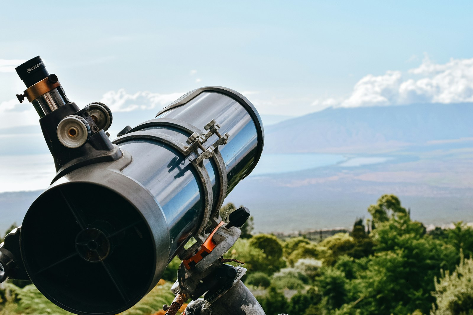 black and silver telescope on green grass field during daytime